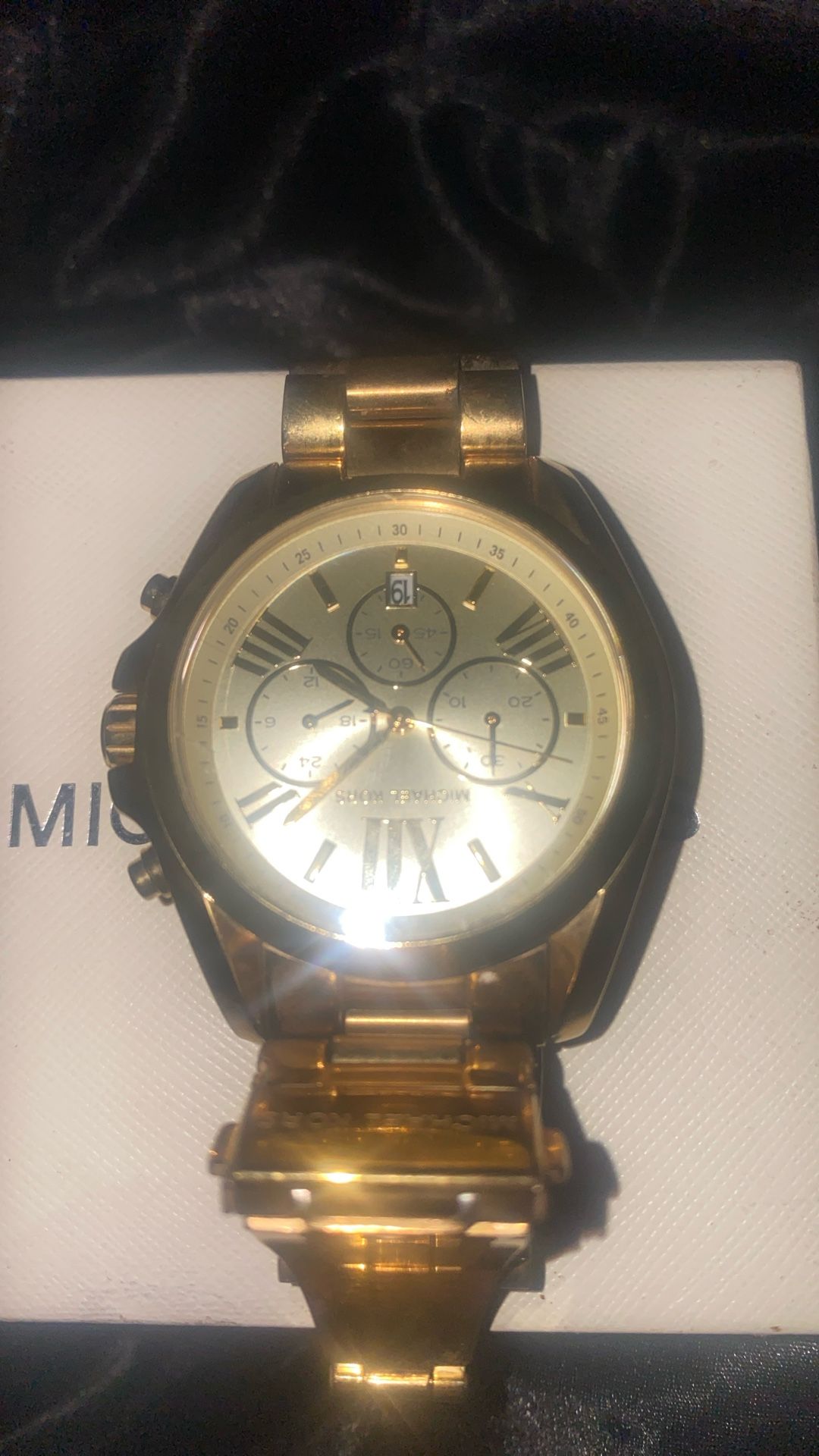 Unisex Michael Kors’s gold watch retail for 350.