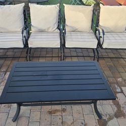 $300  BIG 4 ROCKING CHAIRS AND TABLE WITH CUSHIONS IF YOU WANT THEM 