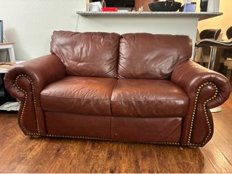 Red leather loveseat couch