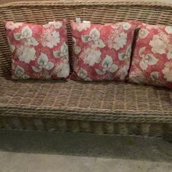 Wicker Sofa with throw pillows