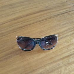 Italy Design Sunglasses with silver snake design on sides.  One little metal piece on side missing,  but not  noticeable  and not affect anything. 