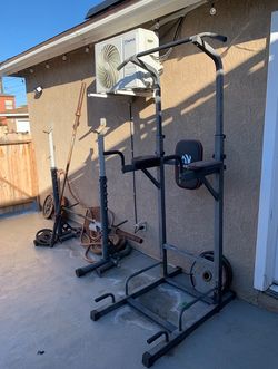 bench\squat rack with bar/weights and / pull up dip bar