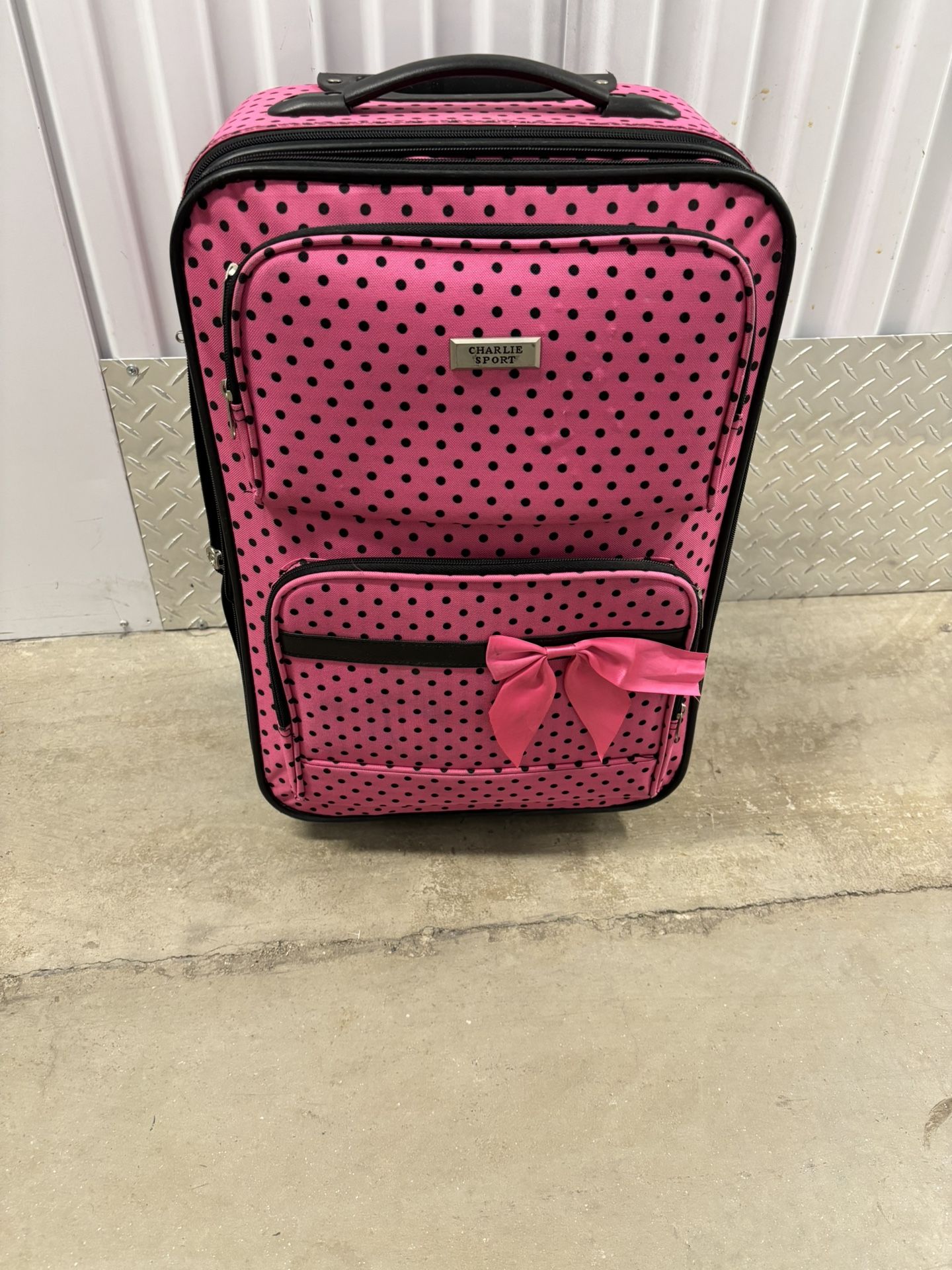 Pink with black polkadots suitcase