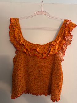 Sofía Vergara Orange flowered top