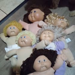 Six Cabbage Patch Dolls 