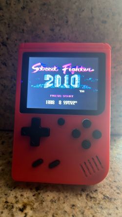 Old school Red Plastic Handheld Electronic Device that plays 500 old school games