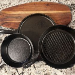 Three Lodge Cast Iron And Exotic Cutting Board 