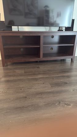 Solid wood TV stand / entertainment center in good condition.