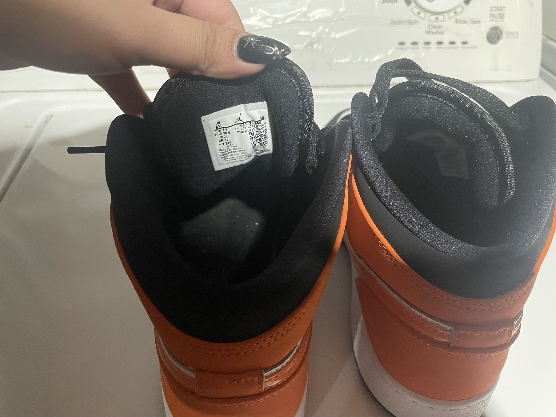 ORANGE AND BLACK NIKES