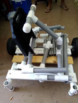 COSTUME MADE FISHING CART MADE OF STRONG PVC YOU CAN FIT UP TO 7 FISHING POLLS WITH BAIT CUTTER ON THE SIDE..ONLY FISHING CART