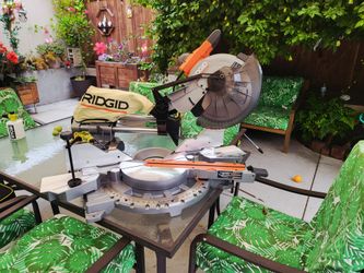 Ridgid 15 Amp Corded 12 in. Dual Bevel Sliding Miter Saw with 70 Deg. Miter Capacity and LED Cut Line Indicator.(Open box never used)