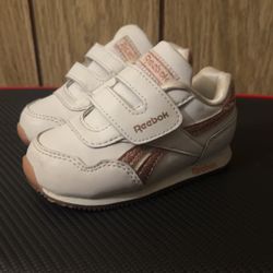 White/pink Reebok Size 5