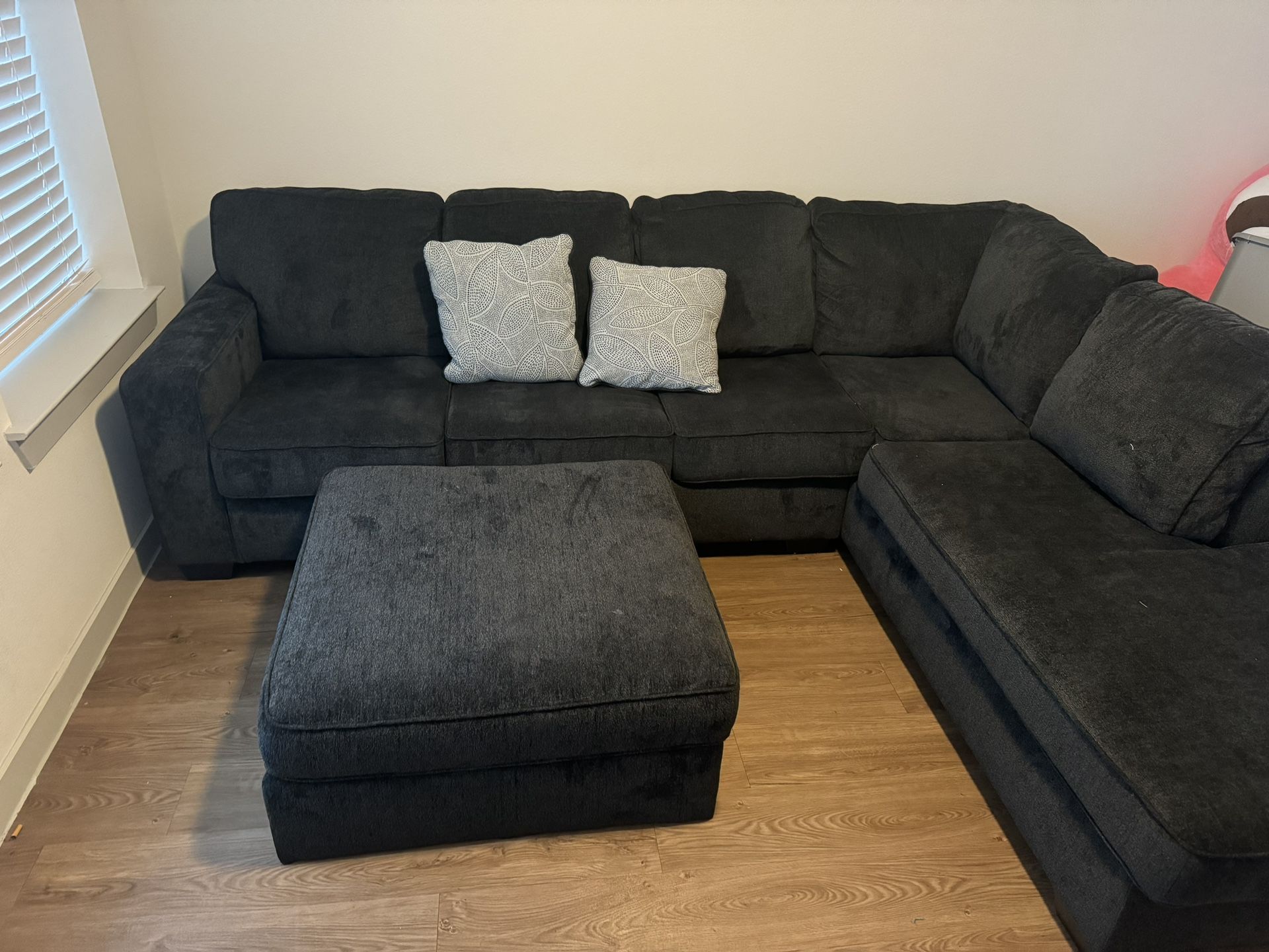 dark grey sectional (ottoman included )
