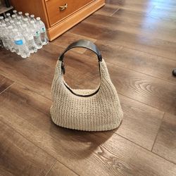 Sigrid Olsen hobo bag features a beige woven crochet body and a black leather handle with thick white contrast stitching, 13"×8"×5", clean and good.