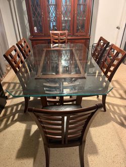 Free Dining room glass table and leather chairs
