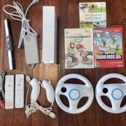 NINTENDO WII with Mario Kart,Wii Sports + 2 Remotes, 2 Nunchuks, 2 Steering Wheels