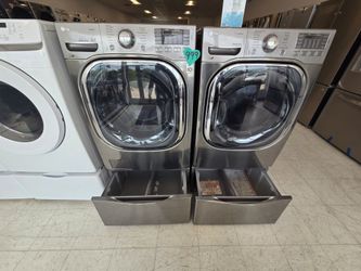 Lg Front Load Washer And Electric Dryer Set with Pedestal used