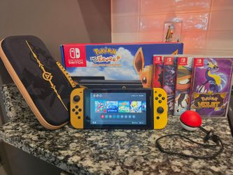 Nintendo Switch Go Eevee special edition with games & case.