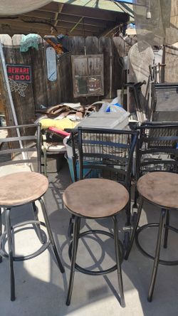Three brown bar stools in mint condition