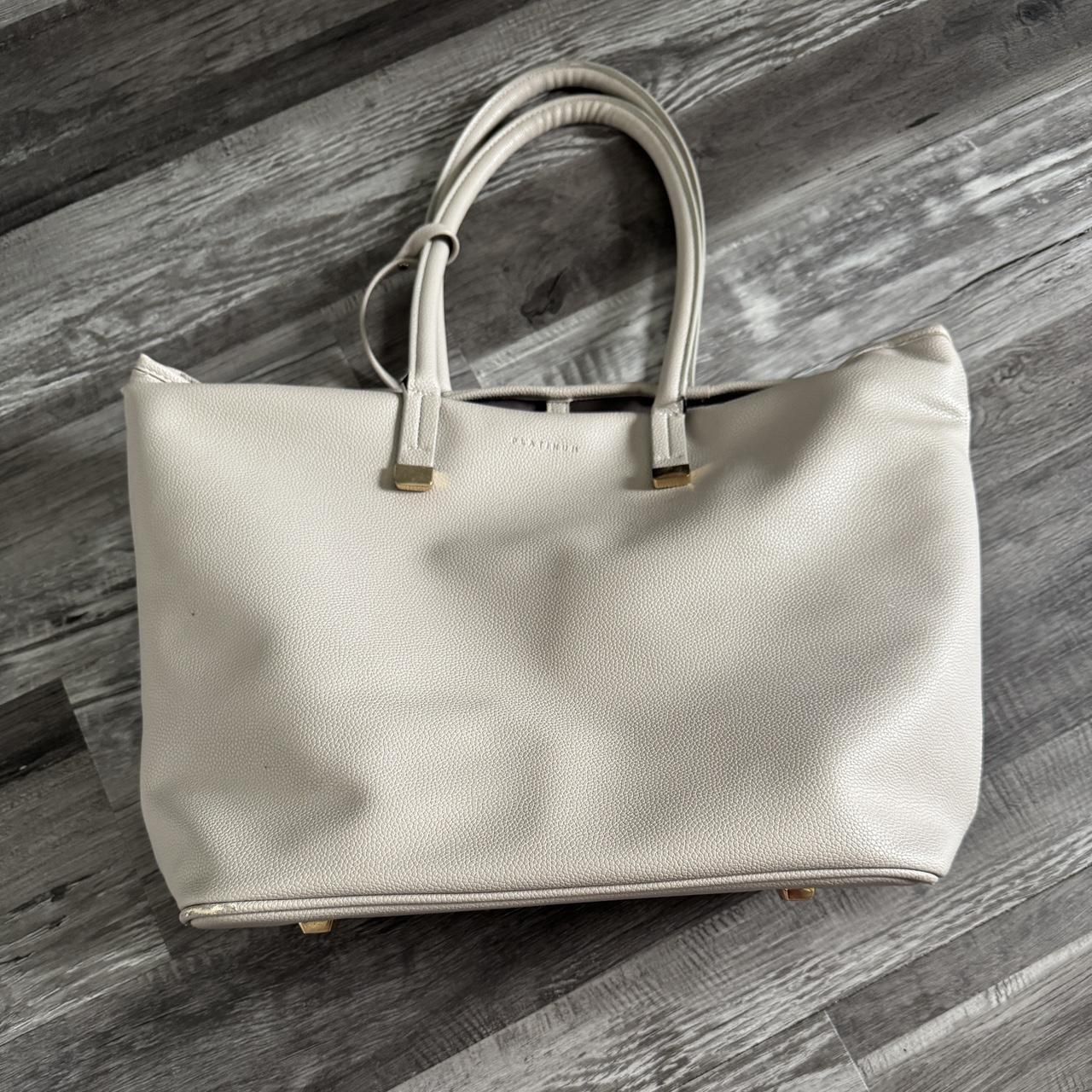 Grey leather tote computer bag. Has 10 pockets (3 are pen pockets). (120)35