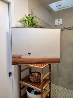 Photographic print on a decorative acrylic glass panel titled "Surfer" by photographer Dieter Reichelt. Framed D: 30.5" x 22.5".
