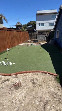 Backyard Putting Green with Flags and Golf Balls