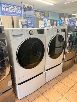LG Front load 4.5 Cu. Ft. Washer and 7.4 Cu. Ft. Gas Dryer with Storage Pedestals