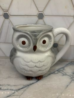 Whimsical ceramic coffee mug is shaped like an owl with a small “hidden” owl figurine inside. World Market brand