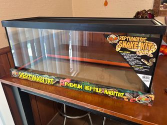 20 gallon reptile tank, lamp fixture, blue bulb, and reptile water comfitioner