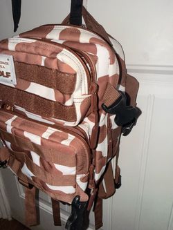 Up for sale is an authentic WOLFpak tactical backpack in the popular brown and white cow print!