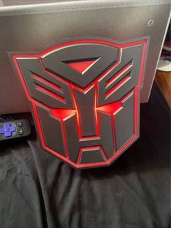 Optimus Prime Autobot light box. The battery light is approximately 9 inches tall and 8.5 inches wide.