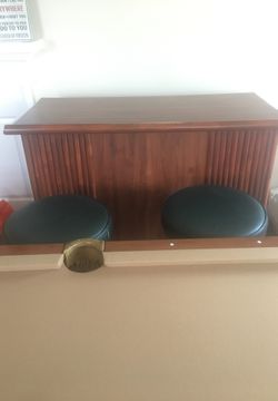 Tiki style bar with swivel stools