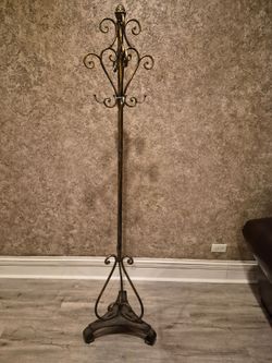 tall decorative wrought-iron/metal coat and hat rack, with an antique bronze/gold finish and