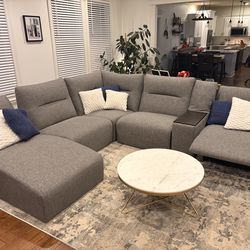 Sectional, coffee table and rug