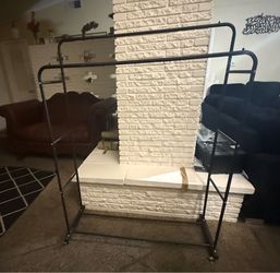 Sturdy metal clothing rack with wheels.44" x58"x52" × 13" Two hanging poles 1 pole height 58" 2 pole height 52'l