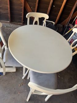 Round Off-White Dining Table with 4 Cushioned Chairs – $40
