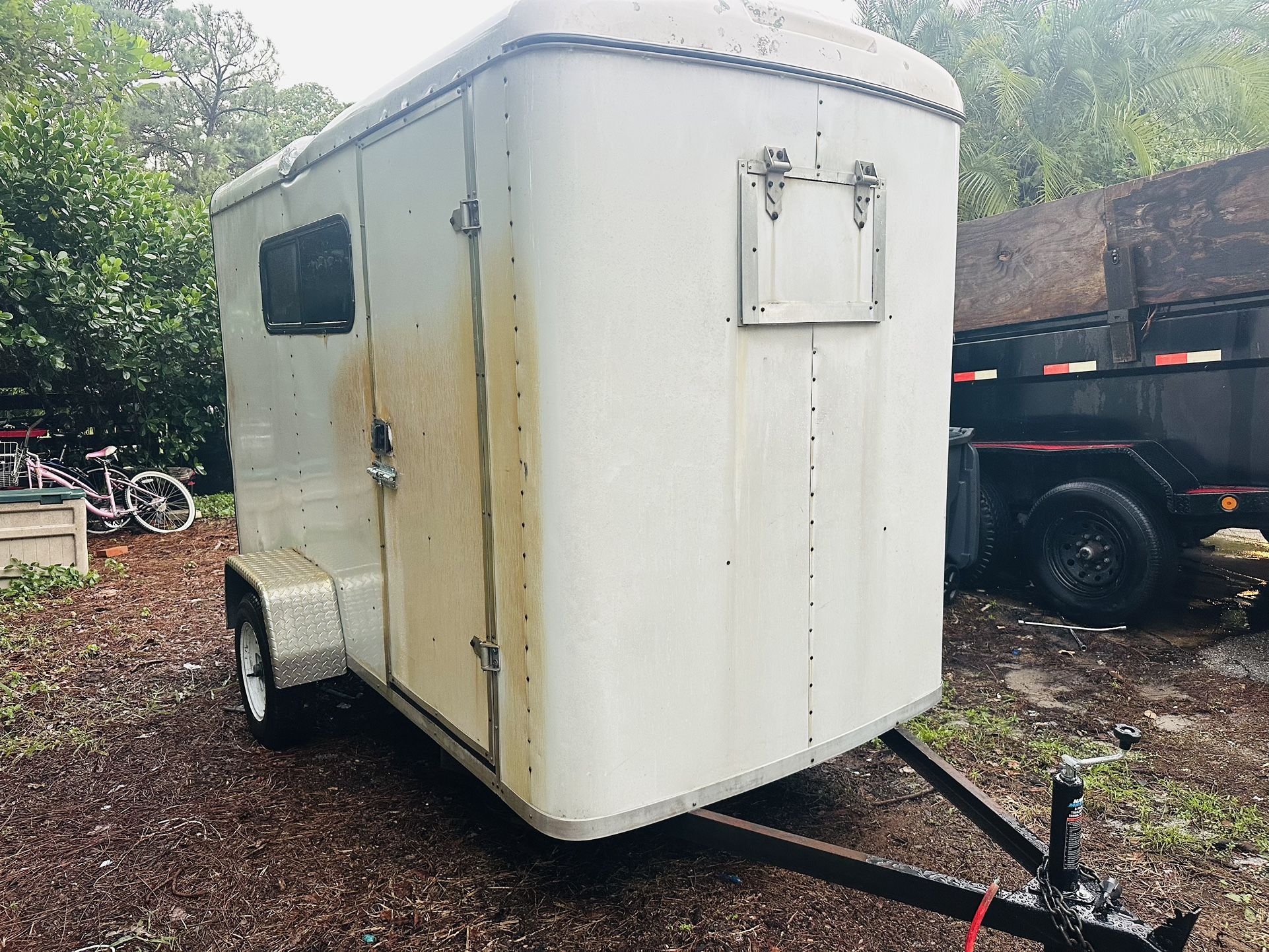Enclosed 5 x 10 trailer. Drop gate lights work has air condition wall unit. Bill of sale