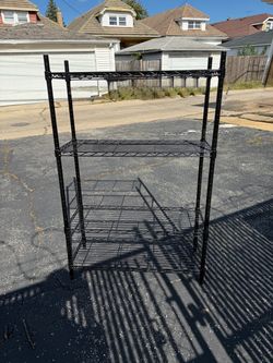 4 SHELVES STORAGE RACK IN EXCELLENT CONDITION. $40.00  OR BEST OFFER.