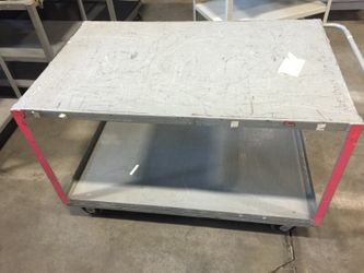 Very heavy duty steel cart with casters.