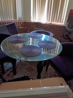 Round  dining table with 4 purple chairs great condition