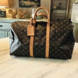 Authentic Louis Vuitton carryallduffle bag