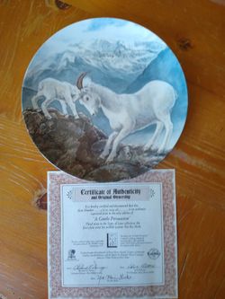 Porcelain plate of a mountain goat n it's baby