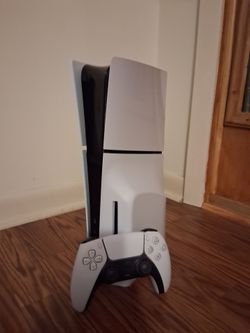 Lightly used PS5 slim with a disk drive and spiderman 2