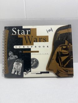 Star Wars scrapbook with a bold gold and black cover. Features iconic characters and space motifs. Spiral-bound style. Great for fandom displays or me