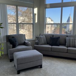 Grey couch , Arm Chair , And Ottoman 