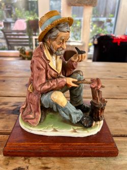 Vintage Japanese Figurine of Man with Bird