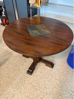 Bar table and 2 chairs. 40” round table