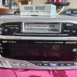 Vintage and Rare Alpine 2 Din CDA-W550E with Alpine CD changer and accessories.