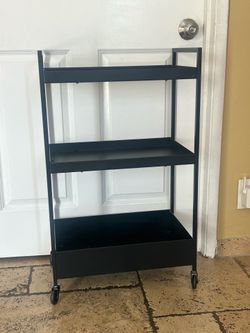 black, three-tiered metal utility cart