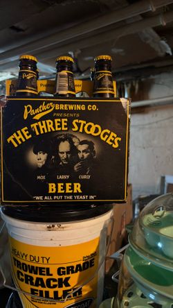Three Stooges beer six pack bottles  are full and labels are still good and￼ the carton